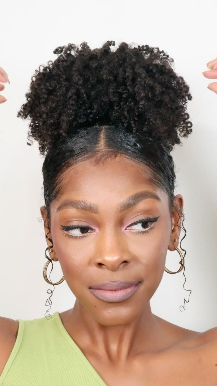 Woman showing a high pineapple updo with tightly defined natural curls