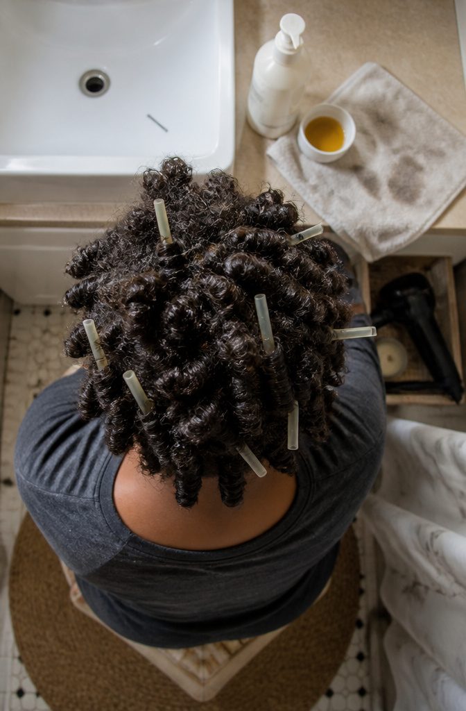 4C hair wrapped around straws and pinned into spiral curls