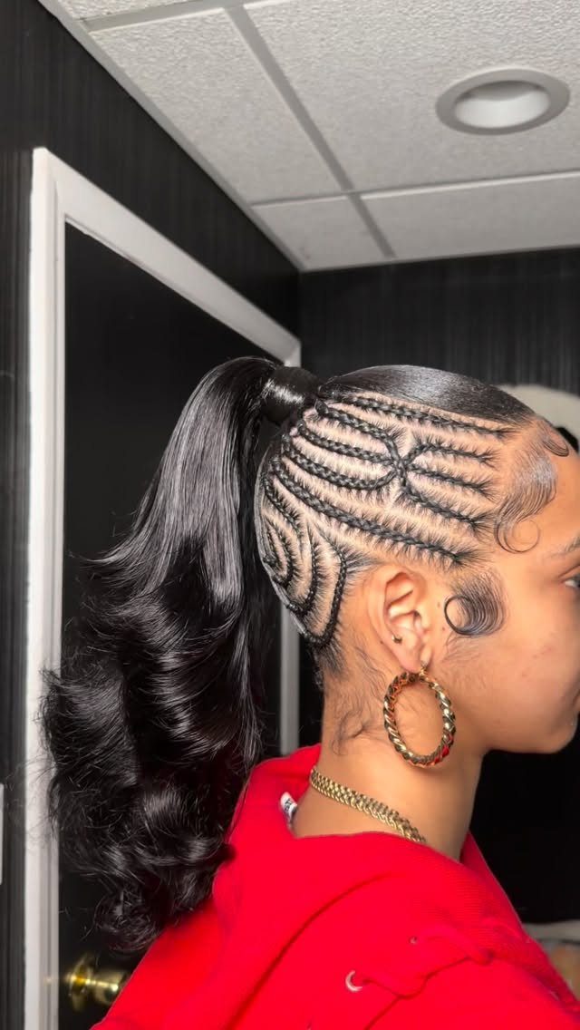 Black cornrows gathered into a high ponytail with long curled ends