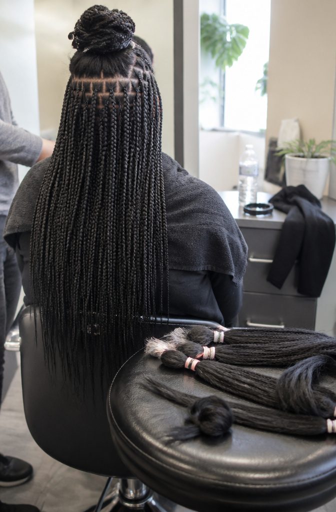 Micro braids beside slightly wider small braids with tiny square partings