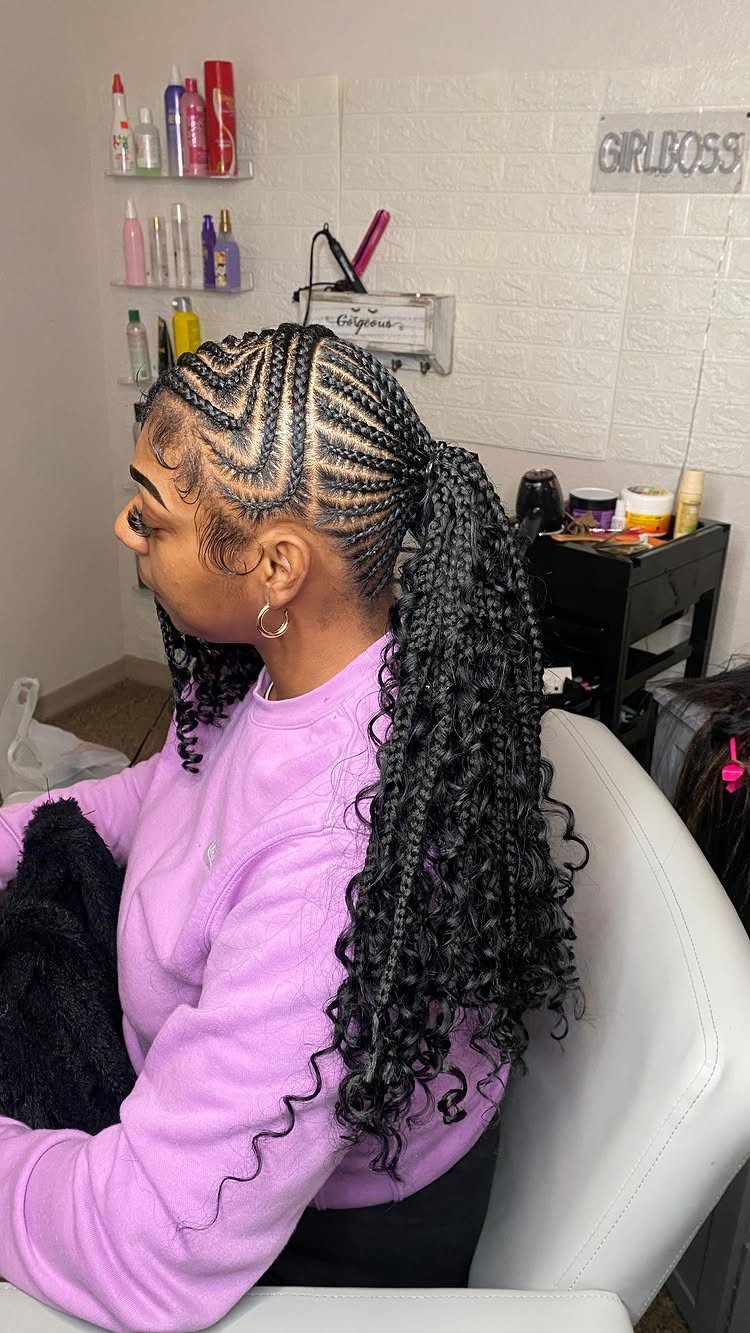 Varied-sized braided ponytail with cornrows and long curly extensions