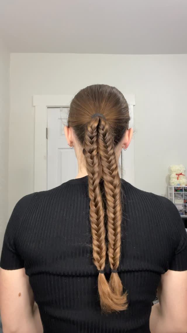 Long brown fishtail braided ponytail viewed from the back