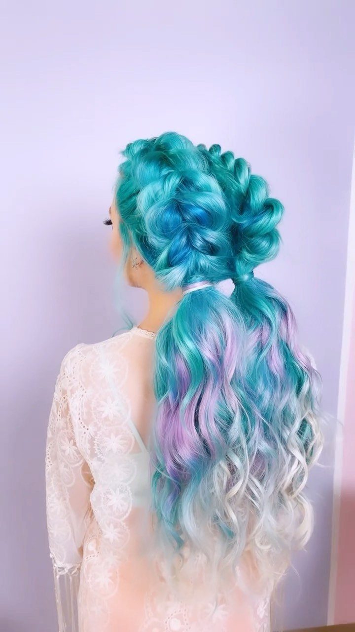 Turquoise and lavender mermaid braid flowing into a long wavy ponytail
