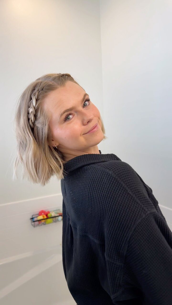 Short blonde bob with a narrow headband braid along one side