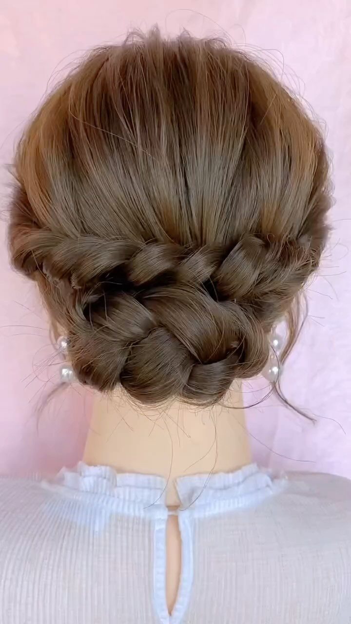 Brown braided bun with braided trim and pearl hair accessories