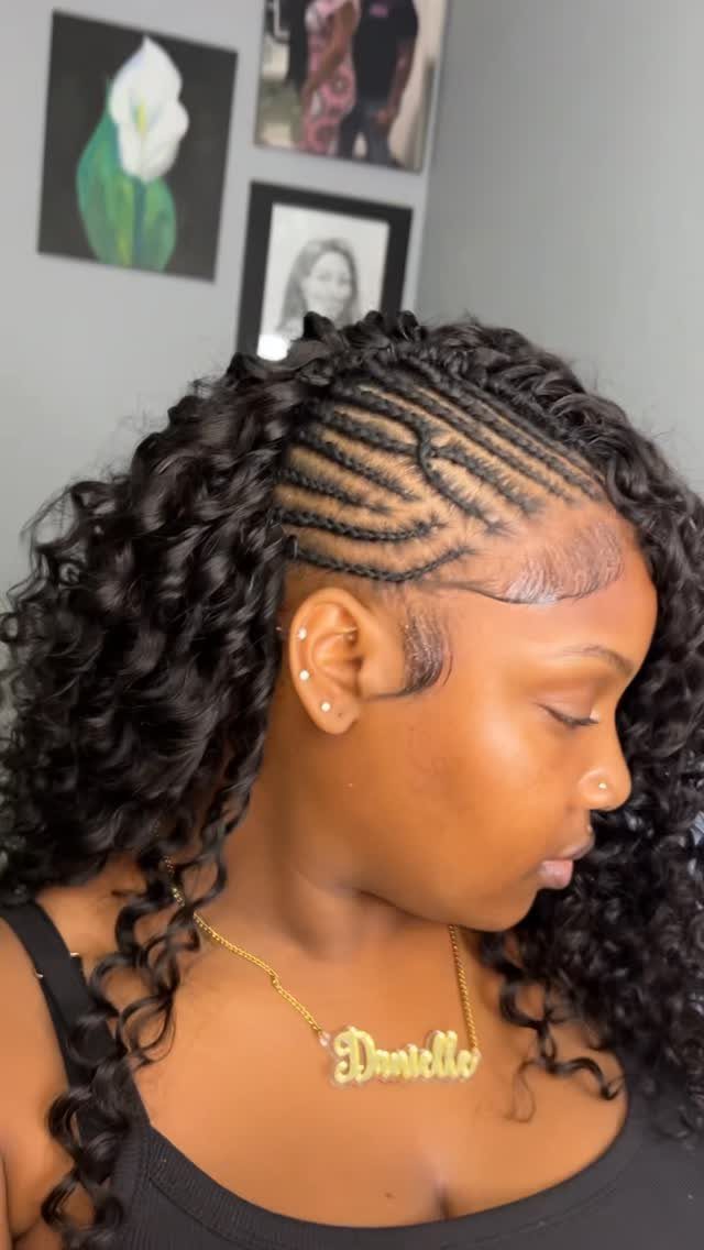 Woman showing long side-swept curly crochet braids and curved cornrows
