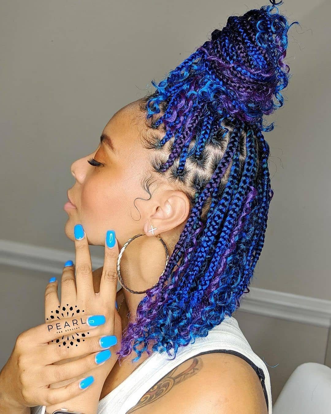 Cobalt-blue braided bob with purple curls styled on a person