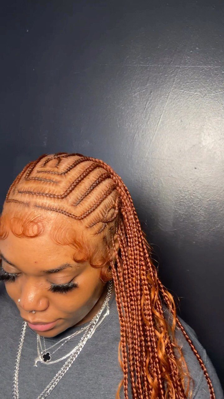 Copper-brown cornrows feed into long braids draped over one shoulder