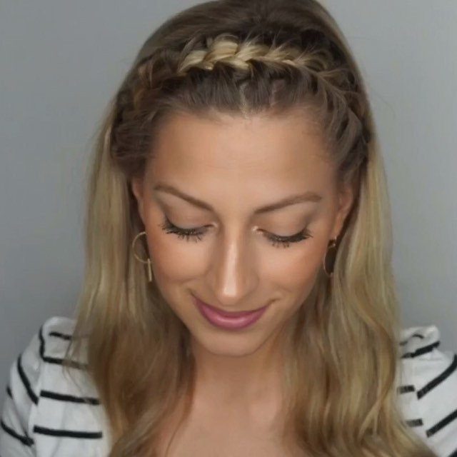 Blonde woman wearing a braided headband with long loose hair