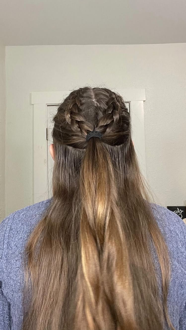 Long brown half-up hairstyle with braided crown and loose flowing lengths