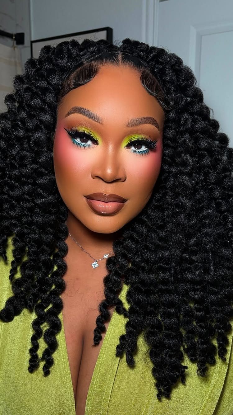 Woman with long, voluminous black Havana twists and curled ends