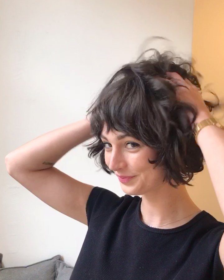Person showing a short, tousled wavy bob with textured fringe