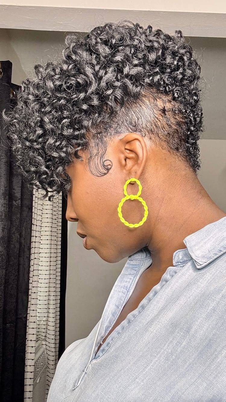 Curly mohawk with long, dense center curls and closely cropped sides