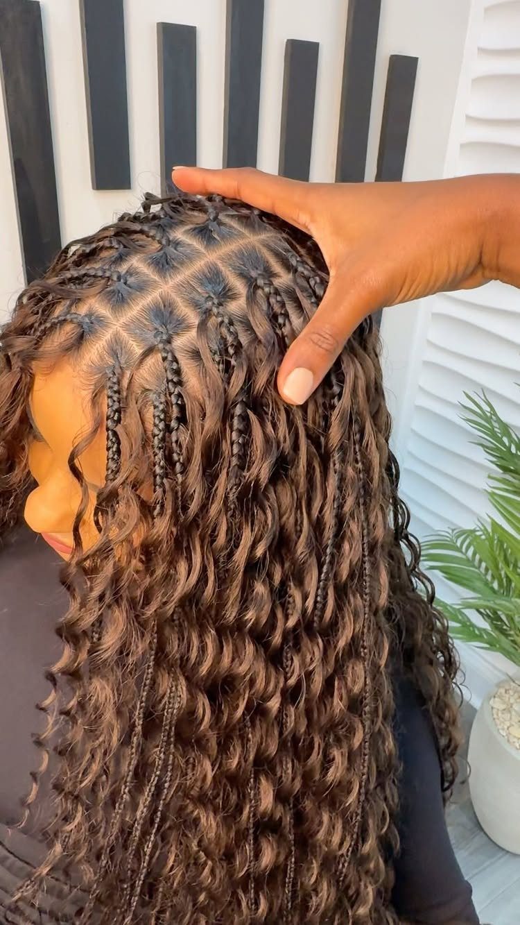 Brown braids with long wavy extensions shown in close-up