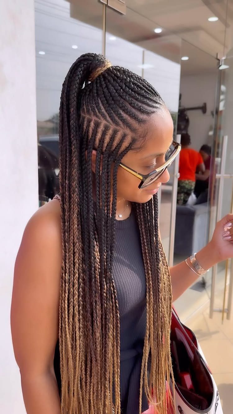 Long ombre braids transition from dark roots to light brown ends
