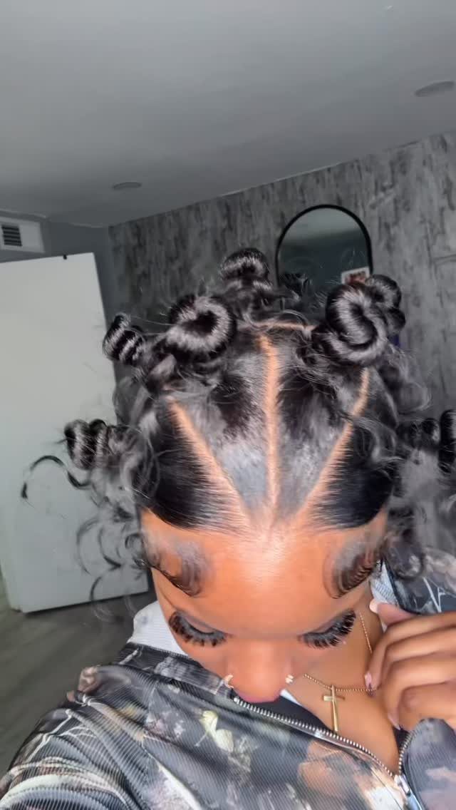 Bantu knots arranged across sectioned natural hair on a person's head