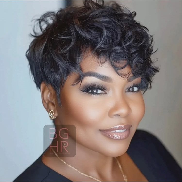 Woman with a short curly pixie cut and shiny, defined curls