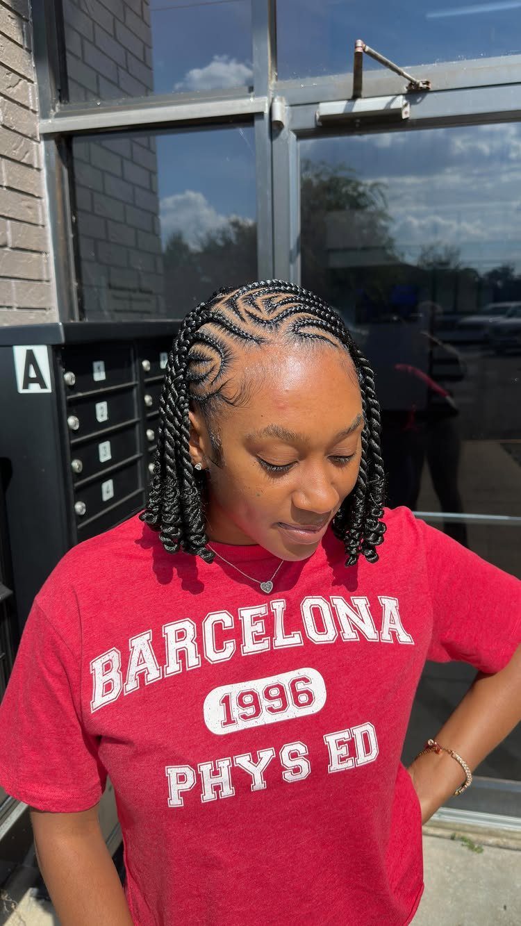 Woman wearing short bob-length braids with curved cornrow patterns