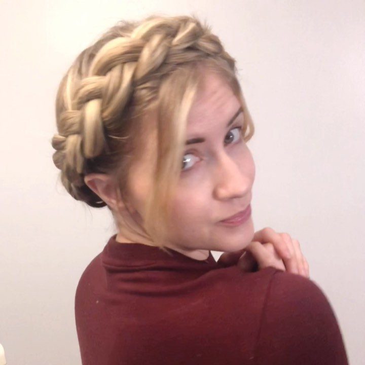 Blonde crown braid wrapped around a woman's head