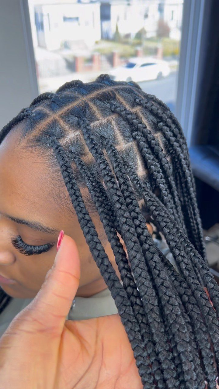 Black knotless box braids arranged in neat sections from the scalp