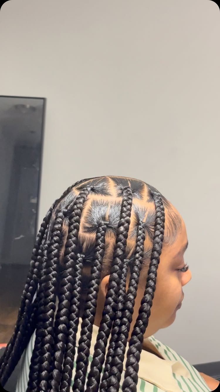 Long box braids transition from dark roots to warm brown lengths