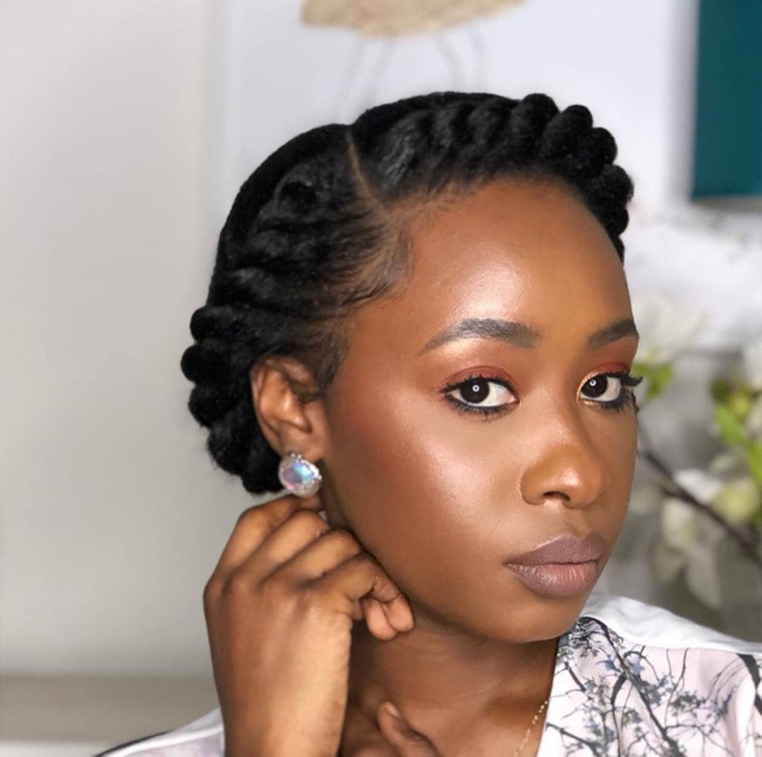 Woman wearing a thick black crown braid wrapped around her head