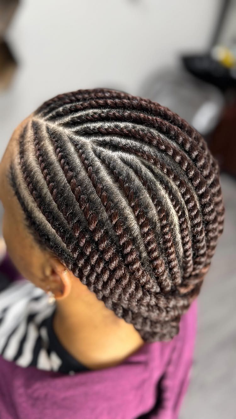Scalp showing neat curved flat twists arranged in parallel sections
