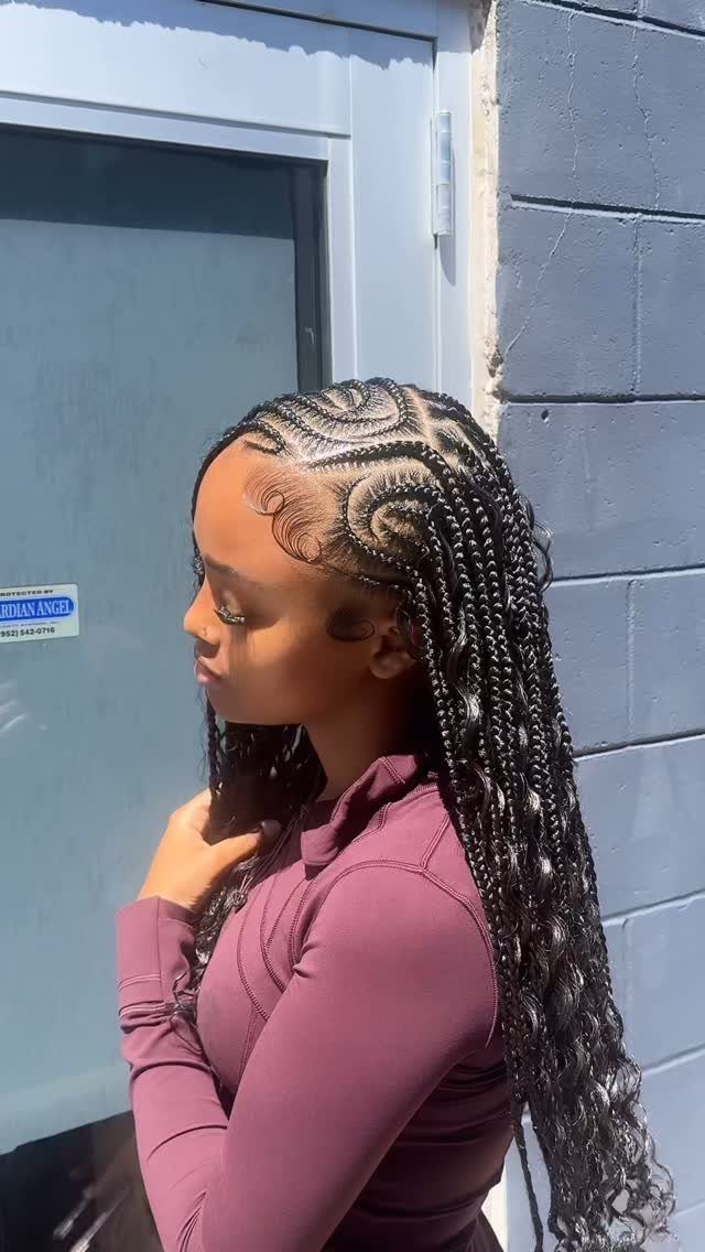 Side-profile person showing long small braids with a defined side part