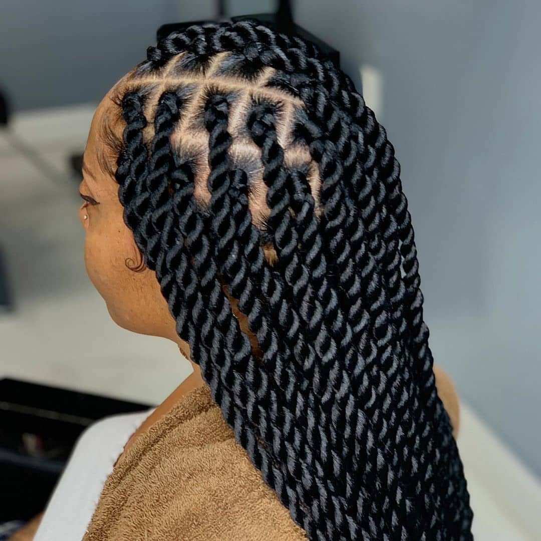 Long black twists arranged in angled sections across the scalp