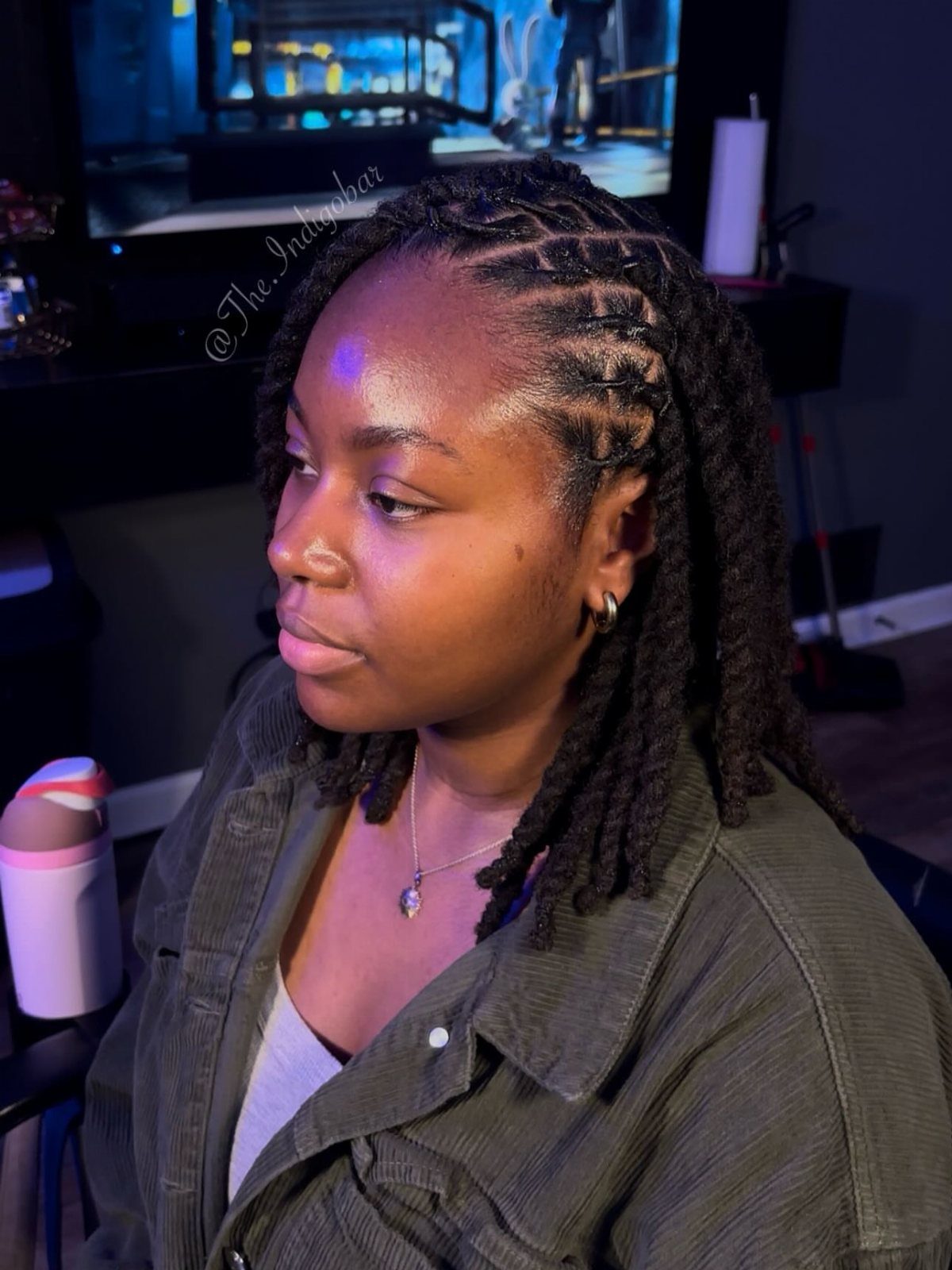 Woman with a side part wearing chunky natural hair twists
