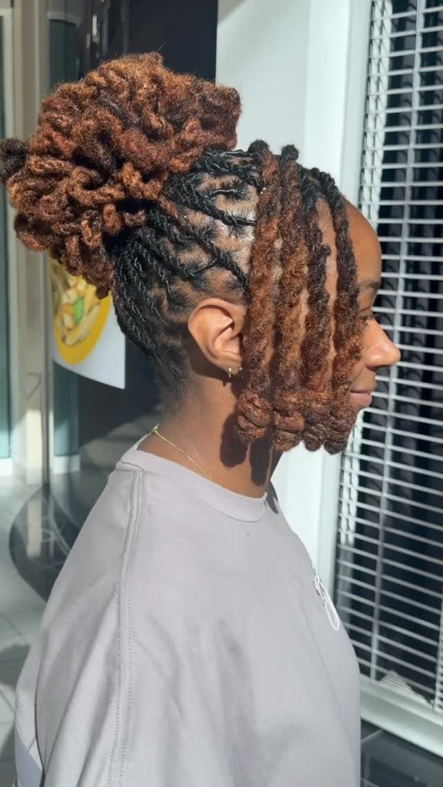 Woman wearing brown twists gathered into a high bun with face-framing twists